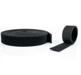 A roll and a length piece of velcro tape, on a white background.
