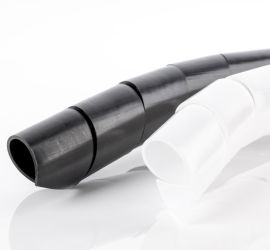 A black and a natural colored spiral wrapping band for bundling cables, on a white background.