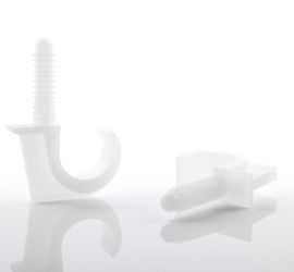 Two white floor clamps, single, one lying down and one standing upright, on a white background.